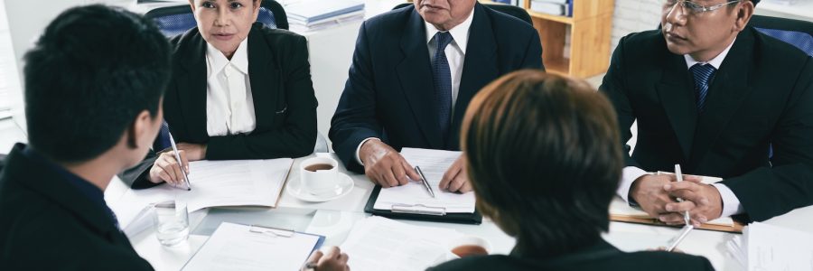 Group of lawyers negotiations during pretrial settlement